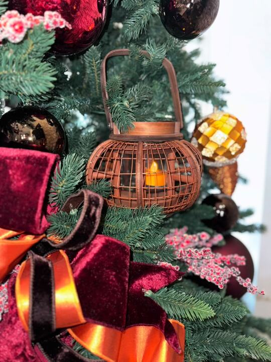 Copper lantern nestled in burgundy velvet