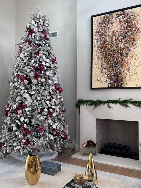 Flocked tree with cranberry ribbon, ivory leaves and champagne ornaments