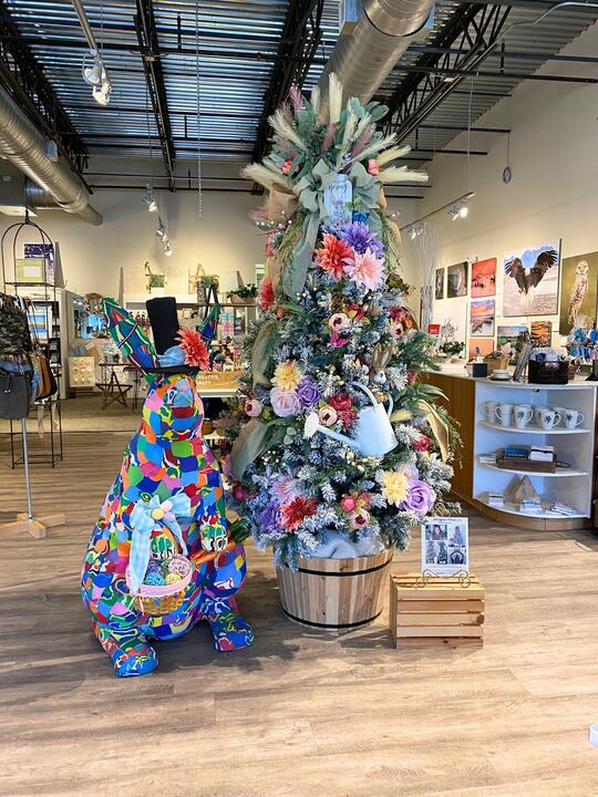 Beach tree with florals and coastal colors in a boutique